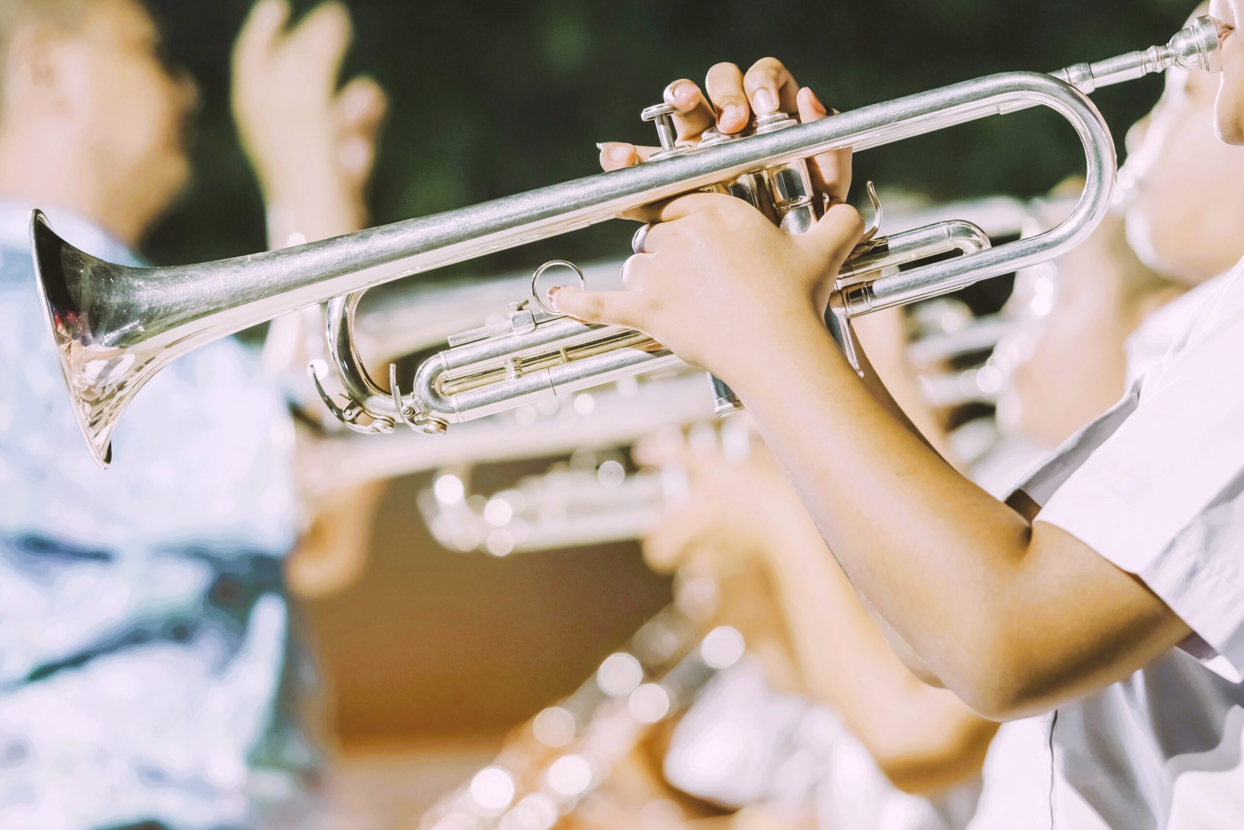 Students in a school band playing trumpets