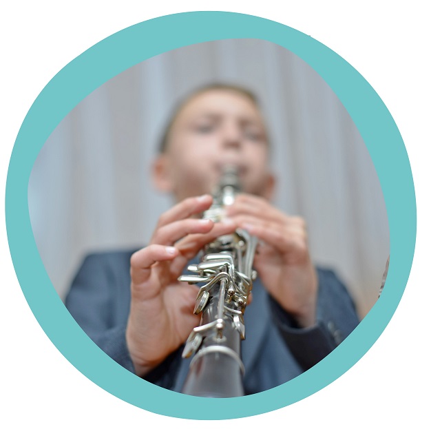 boy playing instrument IN CIRCLE