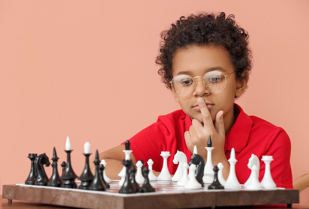 African-American boy playing chess