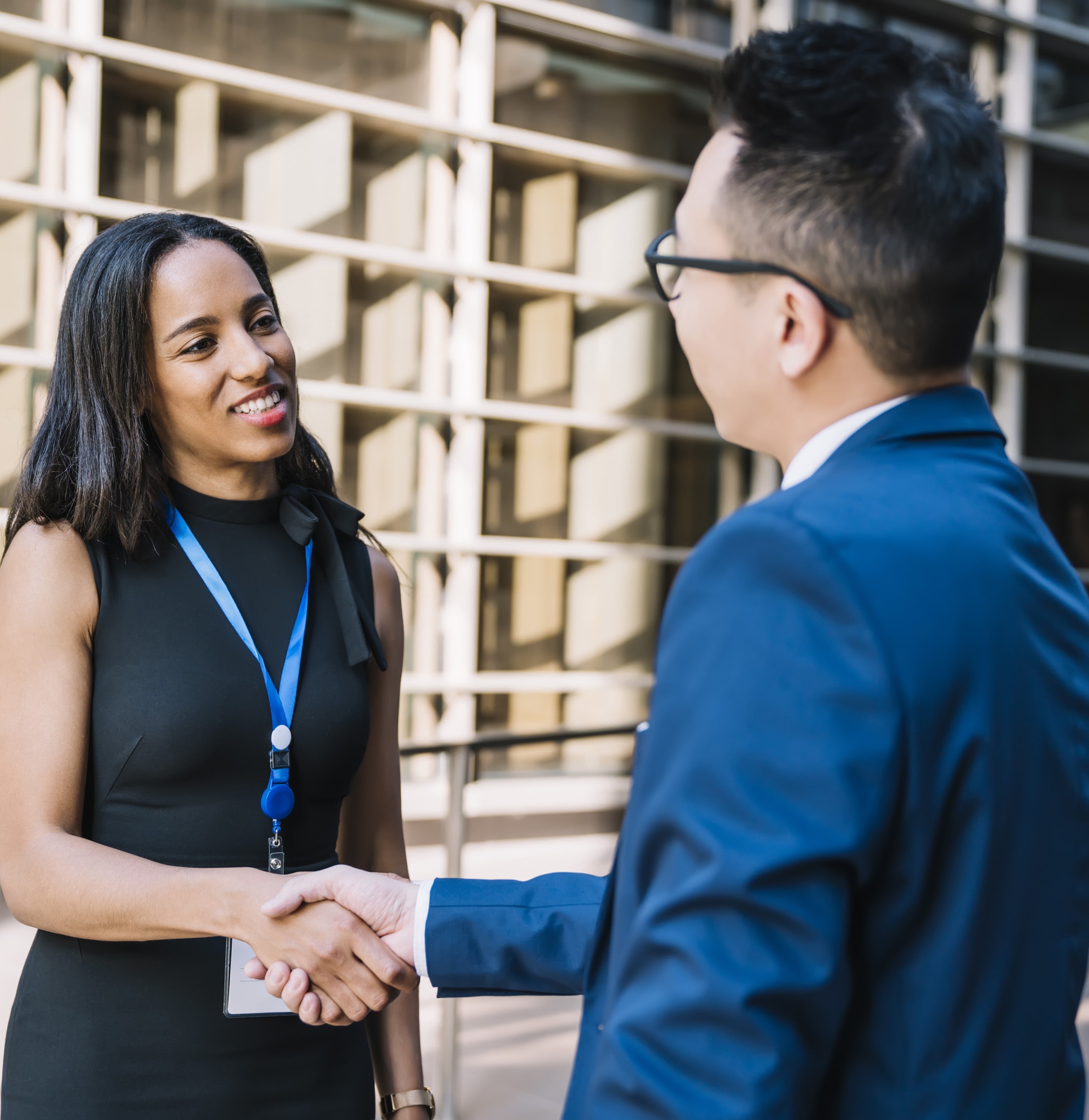 School business leader and business owner shaking hands