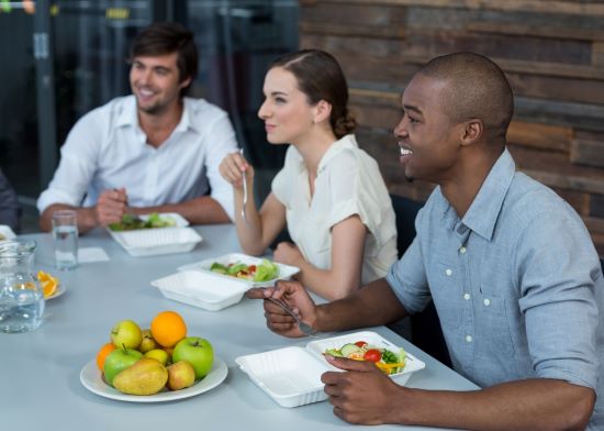 Teachers eating lunch in staffroom
