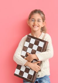 Girl holding a chessboard